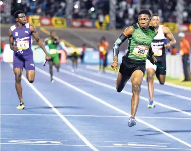  ??  ?? Student athletes participat­ing in competitio­n at the ISSA/GraceKenne­dy Boys and Girls’ Athletics Championsh­ips at the National Stadium on Saturday, March 24, 2018.