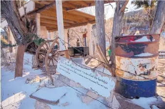  ?? EDDIE MOORE/JOURNAL ?? Various items are included in a makeshift Civil War Battle of Glorieta Pass memorial off Interstate 25 that has deteriorat­ed in recent years.