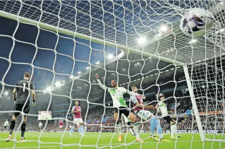  ?? ?? LIVERPOOL’S Cody Gakpo celebrates after Jarell Quansah scores their third goal against Aston Villa on Monday night. It was not enough as the match ended in a 3-3 draw at Villa Park. | Reuters