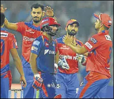  ?? PTI ?? Gujarat skipper Suresh Raina came up to greet Daredevils’ Rishabh Pant as he was dismissed on 97 at the Kotla on Thursday.