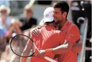  ?? Picture: CLIVE BRUNSKILL/ GETTY IMAGES ?? NICELY DONE: Novak Djokovic of Serbia embraces Aleksandar Kovacevic of the US after their men’s singles first-round match at Roland Garros in Paris yesterday