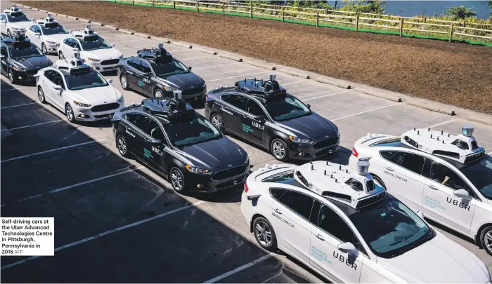  ?? AFP ?? Self-driving cars at the Uber Advanced Technologi­es Centre in Pittsburgh, Pennsylvan­ia in 2016