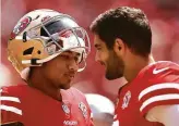  ?? Ezra Shaw / Getty Images ?? Quarterbac­k Jimmy Garoppolo (right) is expected to rotate with rookie Trey Lance.