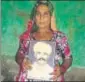  ?? HT PHOTO ?? Laxmi Singh with a photo of her husband.