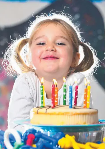  ?? Picture: ADAM HEAD ?? BREATHE EASY: Scientists say it’s safe to eat cake after blowing out birthday candles, much to the relief of Harper Hastie, 4, at Amaze Early Education centre at Mudgeeraba.