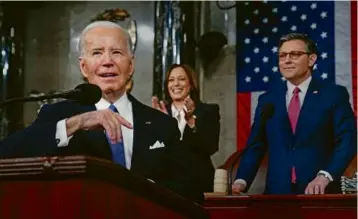  ?? SHAWN THEW/AP ?? President Biden delivered the State of the Union address at the US Capitol, March 7. Standing are Vice President Kamala Harris, background center, and House Speaker Mike Johnson, background right.