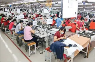  ??  ?? Workers at Tien Tien Textile Joint Stock Company in Vietnam’s southern Tien Giang province. The Sino-US trade war will likely result in Vietnam’s textile industry missing its $40 billion export target this year.