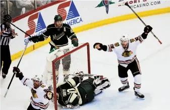  ?? Hannah Foslien / Getty Images ?? Chicago’s Brad Richards ( 91) and Bryan Bickell ( 29) celebrate Patrick Kane’s third- period goal.