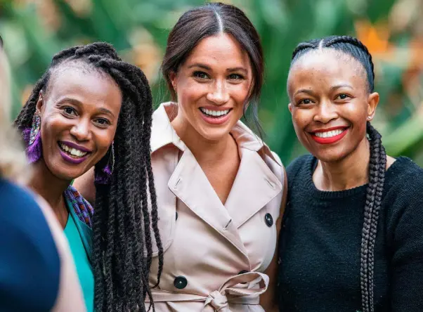  ??  ?? PUBLIC: Meghan (centre) meets delegates at a creative industries and business reception at the British High Commission­er’s residence in Johannesbu­rg last week