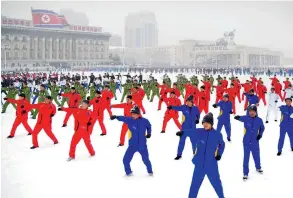  ?? KCNA VIA KNS/ AFP/GETTY ?? A snow day on Kim Il-sung Square in the centre of Pyongyang
