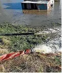  ?? SUPPLIED ?? Pumps work to drain floodwater along the Taieri.