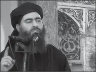  ?? AP ?? This file image taken from video and posted on a militant website on July 5, 2014, purports to show the leader of the Islamic State group, Abu Bakr al-Baghdadi, delivering a sermon at a mosque in Iraq during his first public appearance. The Islamic...