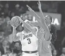  ?? BRYAN TERRY/THE OKLAHOMAN ?? Thunder forward Jalen Williams, center, and guard Cason Wallace, right, defend Lakers forward Anthony Davis.