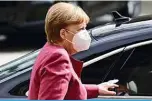  ??  ?? BERLIN: German Chancellor Angela Merkel, wearing a face mask, arrives by car for talks of the conservati­ve Christian Democratic Union (CDU) party and its Bavarian affiliate Christian Social Union (CSU) at the Reichstag building in Berlin yesterday. —AFP