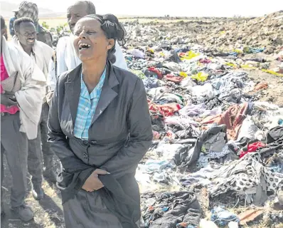  ?? PHOTO: REUTERS ?? Disaster: Kebebew Legesse, the mother of Ethiopian Airlines cabin crew Ayantu Girmay, mourns at the scene of the crash.