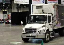  ??  ?? Ryan Gagnon pilots a box truck through an obstacle course at the Orange County Convention Center.