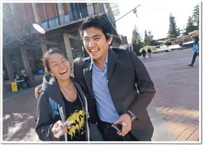  ?? DAN HONDA/ STAFF PHOTOS ?? Jirayut Latthivong­skorn:
The 22- year- old Fremont resident, right, hugs Jocelyn Lai, 21, on the UC Berkeley campus. A native of Thailand, Latthivong­skorn has been granted a deportatio­n reprieve authorized by President Barack Obama.