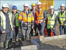  ??  ?? Laying the first brick in the new Pairc na gCon housing estate in Greenville Lane, Enniscorth­y were Nick and Paul Byrne (Byrne & Byrne), Tom Enright (CE Wexford Co. Council), John Carley (Director of Services), Eoghan Murphy, TD (Minister for Housing), Brian O’Gorman (CEO Clúid Housing) and Barry Byrne (Byrne & Byrne).