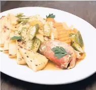  ??  ?? Treat your taste buds with this divine steamed fish with steamed bammy and vegetables.