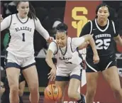  ?? Gina Ferazzi Los Angeles Times ?? JUJU WATKINS, pushing the ball up the f loor, and Sierra Canyon are favored by some local coaches.