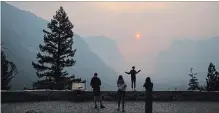  ?? NOAH BERGER THE ASSOCIATED PRESS ?? Hannah Whyatt poses for a photo as smoke from the Ferguson Fire fills Yosemite Valley, in California’s Yosemite National Park, Wednesday.