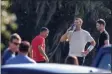  ?? CHRIS URSO/TAMPA BAY TIMES VIA AP ?? Tampa Bay Buccaneers quarterbac­k Tom Brady takes a drink as unidentifi­ed individual­s are seen near him during a private workout June 23 at Berkeley Preparator­y School in Tampa, Fla.