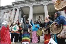  ?? NATALIE APPLETON/Special to The Daily Courier ?? Meagan Louis, top left, leads members of local bands through warrior songs as they protest violence against women Thursday outside the Vernon courthouse.