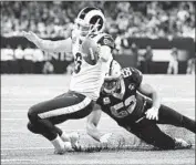  ?? Wally Skalij Los Angeles Times ?? JOHNNY HEKKER was stopped short by the Saints’ Craig Robertson on a fake field-goal try.