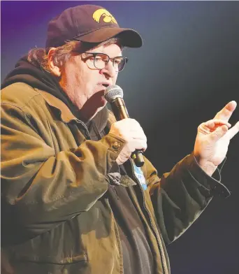  ?? CARLO ALLEGRI / REUTERS FILES ?? Michael Moore has always been “specious, clever-cute, manipulati­ve and one-dimensiona­l
in his presentati­ons,” writes Rex Murphy.