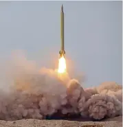  ?? (AFP) ?? This handout photo released on Saturday shows a launch of a missile during a military drill in an unknown location in central Iran