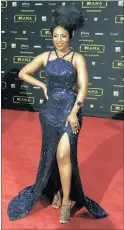  ??  ?? NOMZAMO MBATHA (ABOVE) @Red__Mos: I don’t like her overall styling. The
doek, the shoes, the jewelry. It’s all wrong for such a sparkly gown. @wittnsass: Swear I’ve seen a matric dress like this so yeah no need for an American designer! Also those...