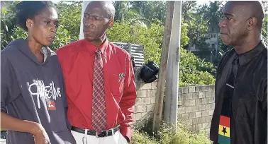  ??  ?? Principal of St James High School Joseph Williams (right) wants the hangman to be brought out of retirement. Here he looks on as Phillip Johnson, a guidance counsellor at St James High, consoles Valesha Vidal, mother of Tianna Clarke.
