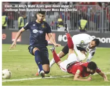  ??  ?? Clash...Al Ahly’s Walid Azaro goes down under a challenge from Esperance keeper Moez Ben Cherifia