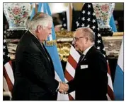  ?? SEBASTIAN PANI/AP ?? Secretary of State Rex Tillerson, left, greets Argentinia­n Foreign Minister Jorge Faurie.