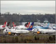  ?? (Bloomberg/David Ryder) ?? Grounded Boeing 737 Max airplanes sit in a parking lot near Boeing Field in Seattle earlier this month.