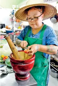 ??  ?? All her own: Chef Dao blending spices. Priyantha Wickramaar­achchi