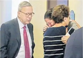  ?? RED HUBER/STAFF PHOTOGRAPH­ER ?? James “Bob” Ward’s, left, request to leave Florida to attend the wedding of his daughter Sarah Ward, far right, in Georgia is denied. Sarah’s aunt Paula Saare comforts her after the ruling.