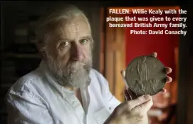  ??  ?? FALLEN: Willie Kealy with the plaque that was given to every bereaved British Army family. Photo: David Conachy