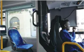  ?? (Marc Israel Sellem/The Jerusalem Post) ?? AN EMPTY bus seat behind a bus driver following the Transporta­tion Ministry’s announceme­nt yesterday.