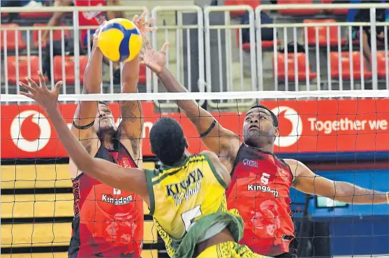  ?? Picture: ELIKI NUKUTABU ?? Mid Central players, from left, Bernard Vukivuki and Inia Delai, block out a Kinoya spike at the Vodafone Arena in Suva yesterday.