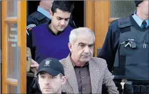  ?? Lars Hagberg, Reuters ?? Mohammad Shafia, centre, and son Hamed, top, leave court in Kingston, Ont. They and Tooba Mohammad Yahya were found guilty on Sunday of first-degree
murder in the deaths of four family members.