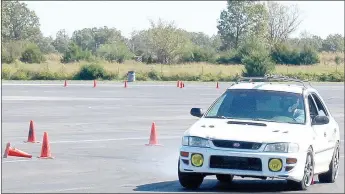  ?? Keith Bryant/The Weekly Vista ?? Hayden Curren exits a right-hand turn in his 1998 Impreza.