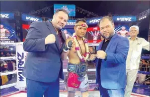  ?? SUPPLIED ?? (From left to right) IPCC World president Sasan Ghosairi, Kun Khmer boxer Phal Sophoan and Mas Fight Cambodia president Kim Srun Kosal pose for a photo on July 30.