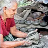  ??  ?? Expert touch: Alice nona shaping the clay