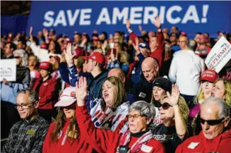  ?? New York Times file photo ?? Attendees pray at a rally for former President Donald Trump in Michigan last April. White evangelica­l voters were central to Trump’s first election, but some support is waning.