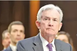  ?? AP PHOTO/MARIAM ZUHAIB ?? Federal Reserve Chairman Jerome Powell listens Tuesday during a Senate Committee hearing to examine the Semiannual Monetary Policy Report to the Congress on Capitol Hill in Washington.
