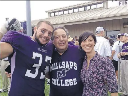  ?? CONTRIBUTE­D ?? Nicole with her father, Larry (center), and brother, Joe, at a Millsaps College football game.