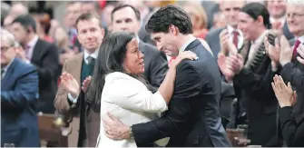  ??  ?? Prime Minister Justin Trudeau is embraced by Justice Minister Jody Wilson-Raybould after delivering a speech on the recognitio­n of Indigenous rights in in the House of Commons on Wednesday.