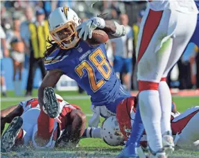  ?? JAKE ROTH/USA TODAY SPORTS ?? Chargers running back Melvin Gordon rushed for two TDs Sunday before suffering a knee ligament sprain that left him week-to-week.