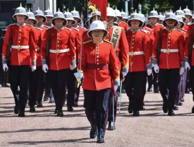  ?? JOHN STILLWELL/WPA/GETTY IMAGES ?? Capt. Megan Couto of the 2nd Battalion, Princess Patricia’s Canadian Light Infantry, commands the Queen’s Guard on Monday.
